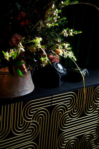 Detail of sideboard in Black, Gold and Walnut