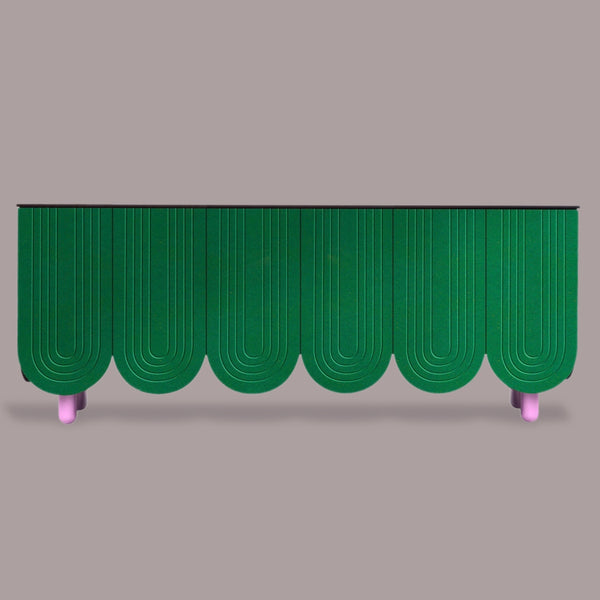 Green textured cabinet with pink legs on a gray background