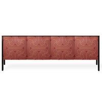 A long red sideboard or credenza with six front panels featuring a gold geometric pattern, supported by slim black legs, shown against a plain white background.