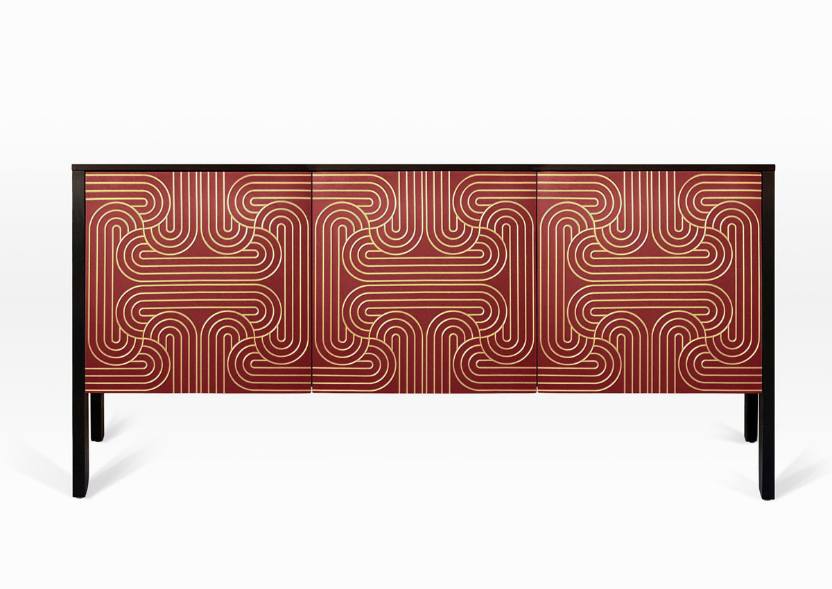 Sideboard with a red and gold patterned doors and black sides. Elegant sideboard with nod to art deco.
