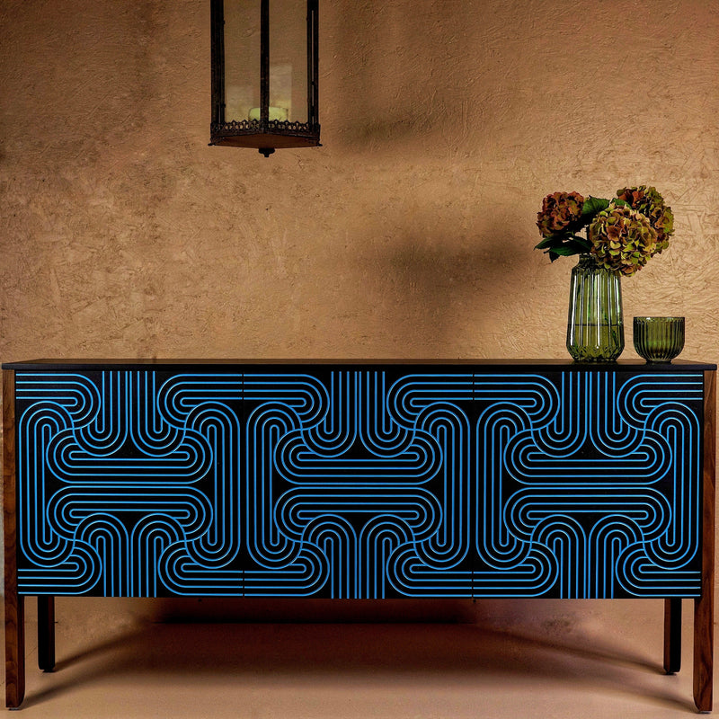 Cabinet with blue geometric pattern on a beige wall