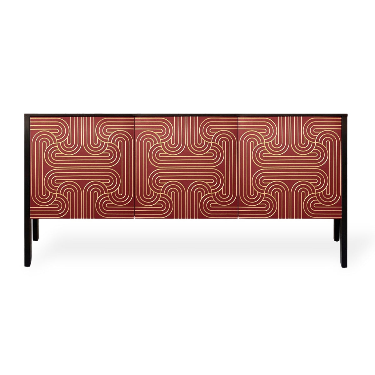 A modern sideboard or credenza with geometric patterned doors in red with a carved pattern painted in gold. Supported by slim black legs, shown against a plain white background.