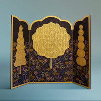 Decorative triptych with gold and multicoloured hand carved and painted design on a black background