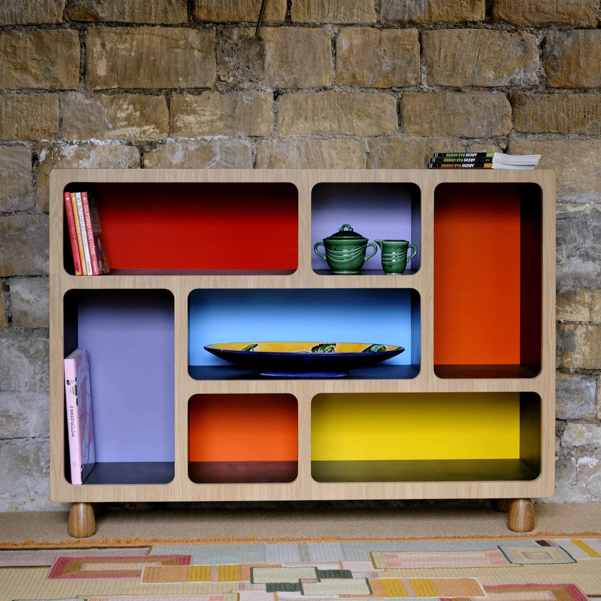 Display cabinet with multi coloured back. Boulder Display Unit